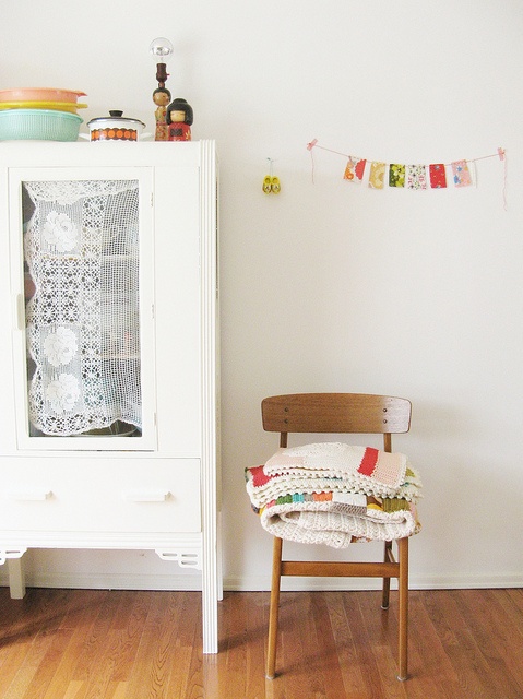 Fabric panelled cupboard doors by www.apartmentapothecary.com